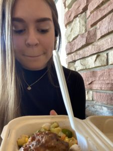 student ready to eat a takeout meal